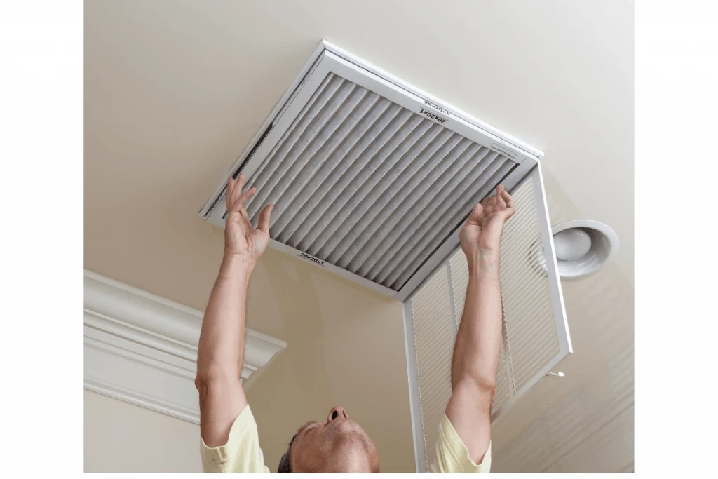 man changing air filter