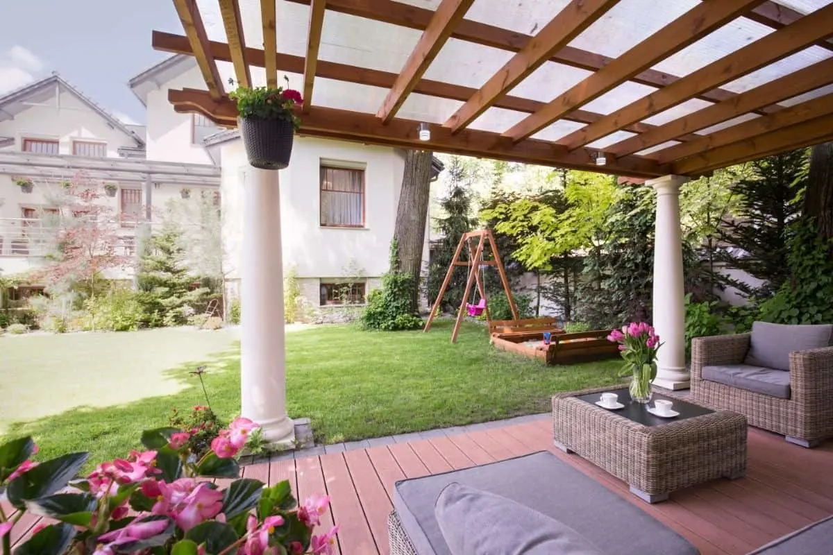 pergola over sitting area with furniture