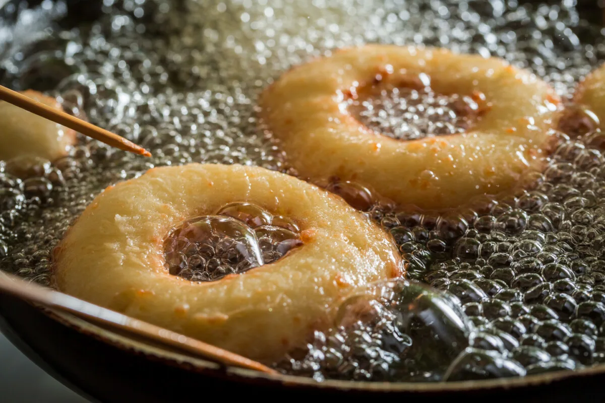 Frying sweet and tasty donuts