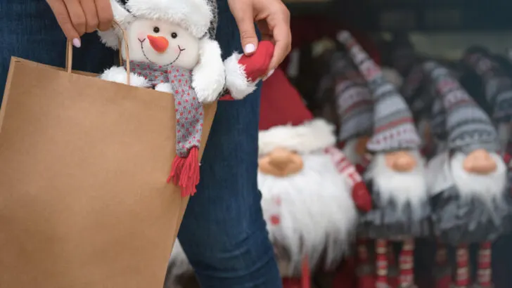Female carrying a Christmas gift