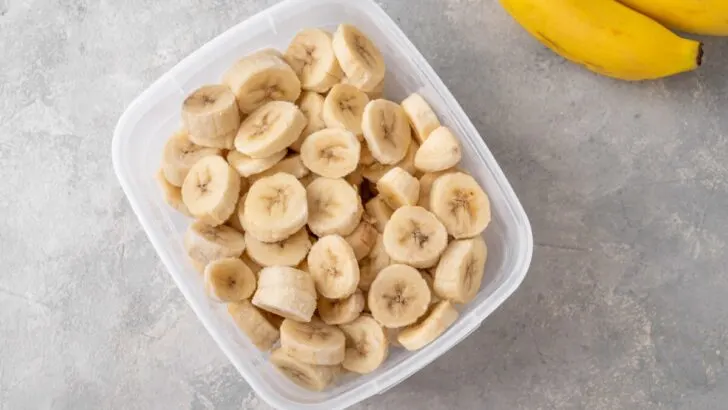 Slices of frozen banana in a container